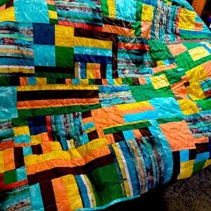 Colorful  50 “x62” lap quilt.   Beautiful colors.